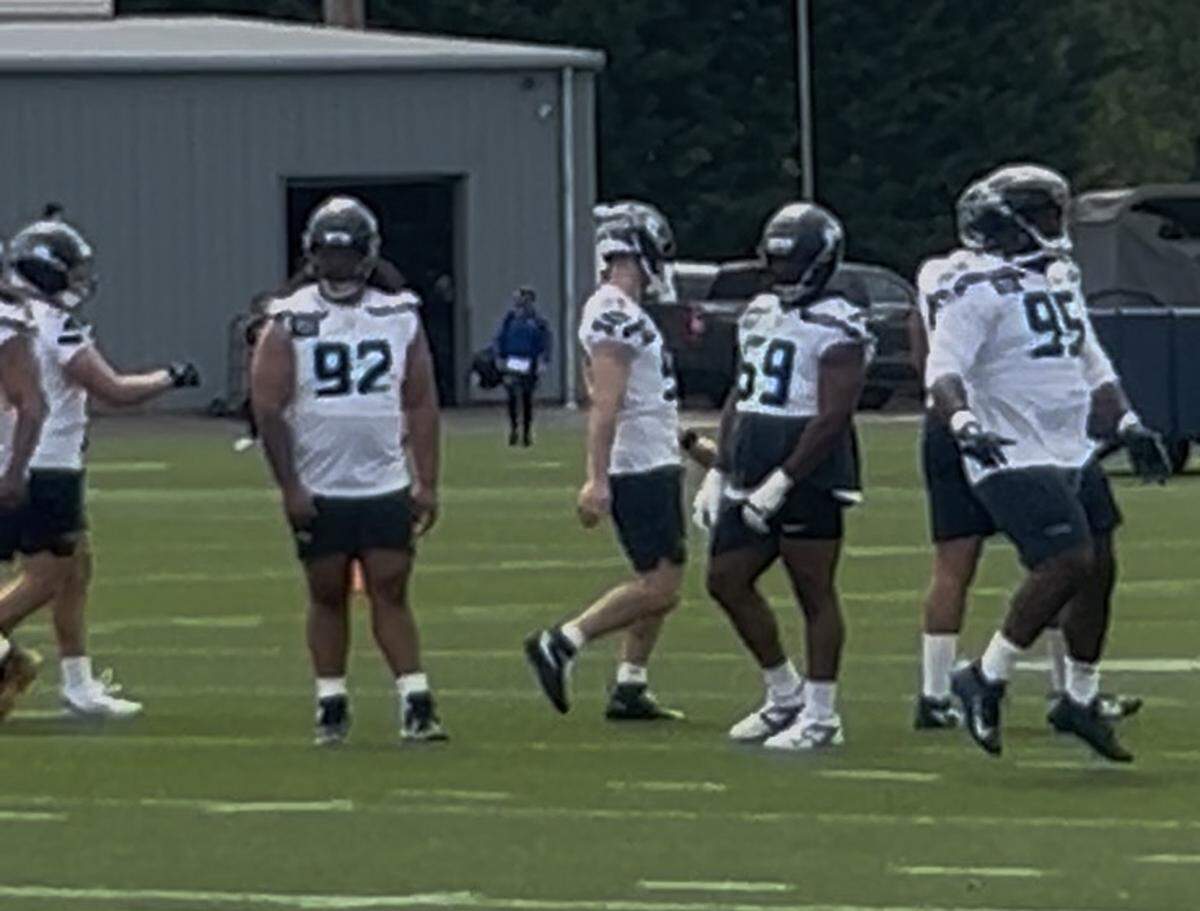 Undrafted free agent Uso Seumalo (92) among tryout players Marvin Jones Jr. (59), Herbert Gums Jr. (95) and others at Seattle Seahawks NFL rookie minicamp Friday, May 1, 2026, at the Virginia Mason Athletic Center in Renton.