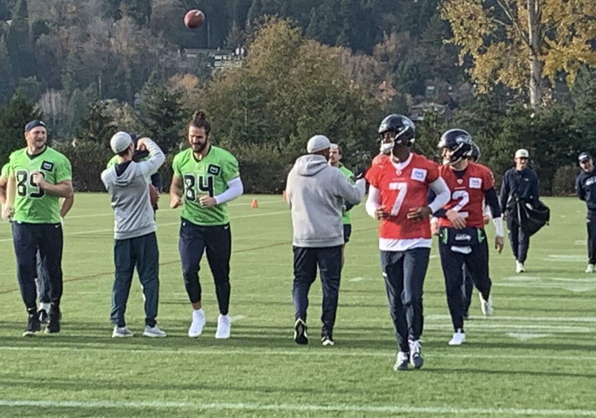 Still-hurting quarterback Geno Smith (7) participates in the start of Seahawks practice Nov. 21, 2023, two days after Los Angeles Rams tackle Aaron Donald bruised Smith’s triceps on his throwing arm -- and two days before Seattle plays the San Francisco 49ers at Lumen Field.