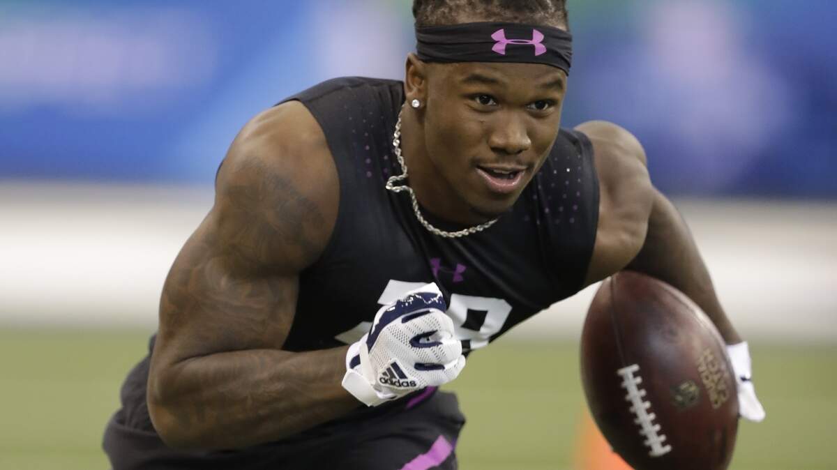 Wisconsin defensive back Nick Nelson runs a drill during the NFL football scouting combine, Monday, March 5, 2018, in Indianapolis. (AP Photo/Darron Cummings)