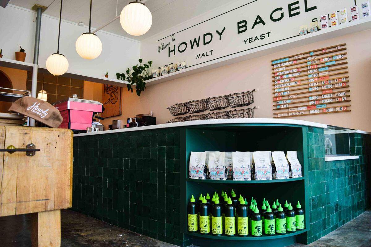 Howdy Bagel’s storefront at 5421 South Tacoma Way is airy, with peachy walls and hunter-green accents.