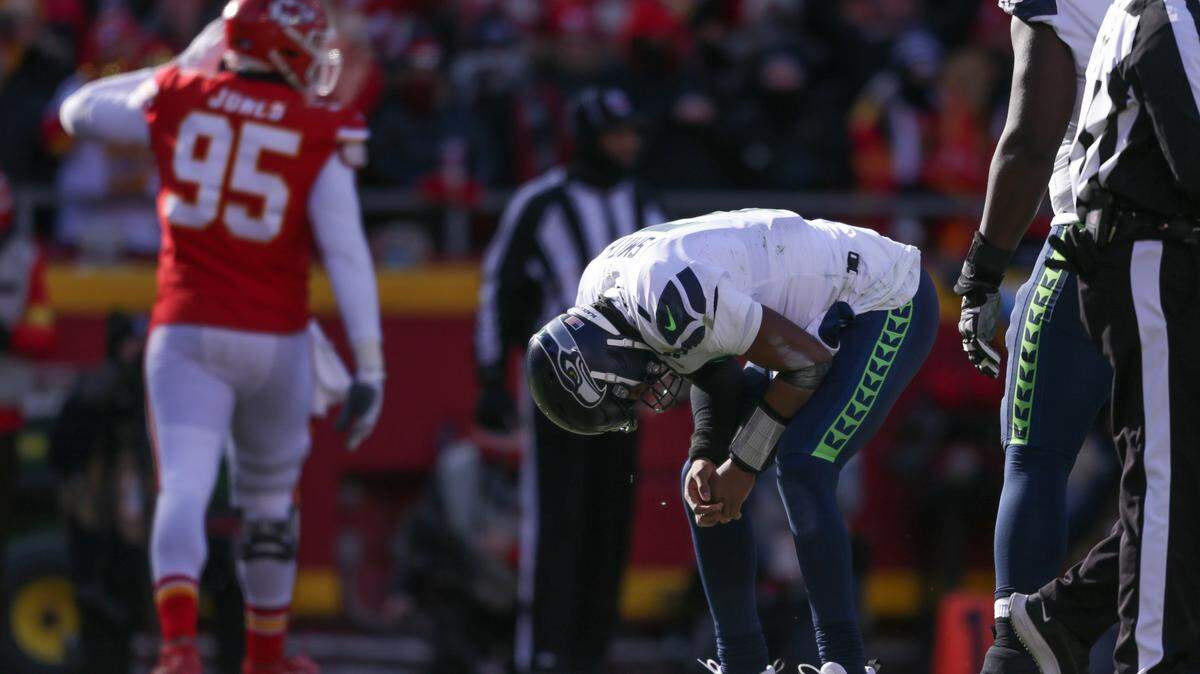 Seattle Seahawks quarterback Geno Smith (7) reacts after he is sacked during the second quarter against the Kansas City Chiefs on Saturday, Dec. 24, 2022, in Kansas City, MO.