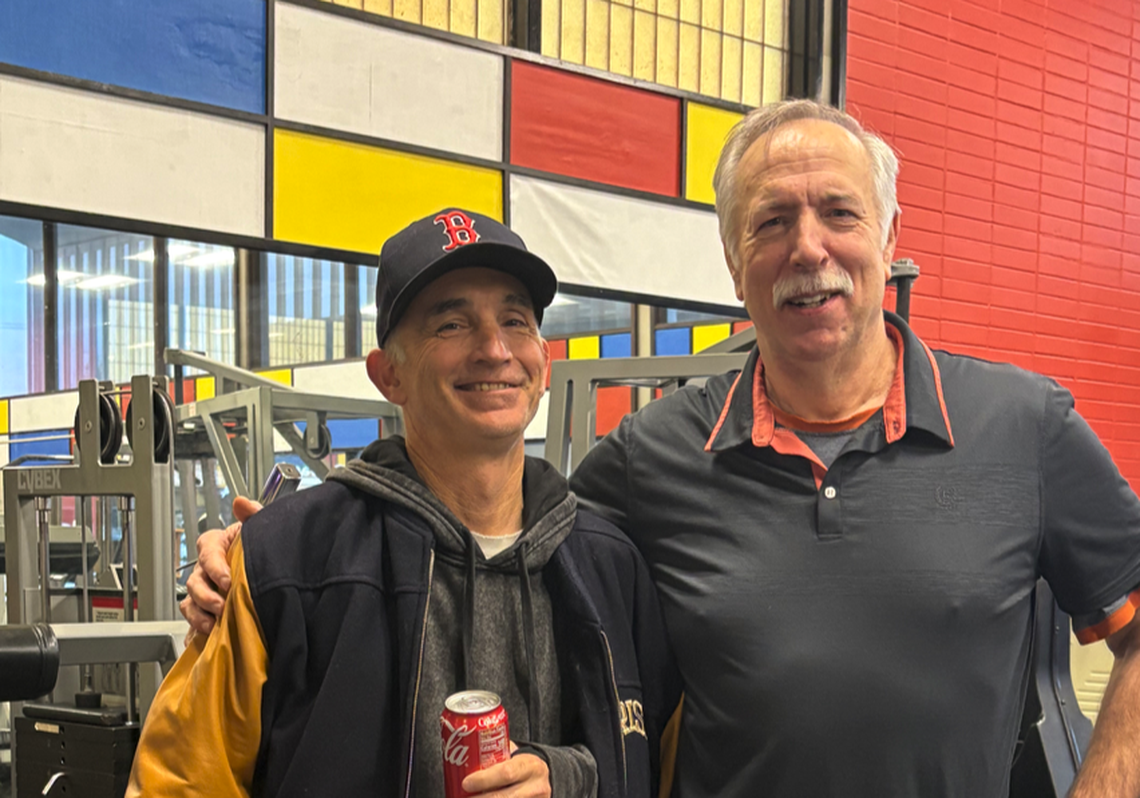 Surina, right, and a friend celebrate at a party thrown to commemorate Surina and the Exercise Science Center before it closes.