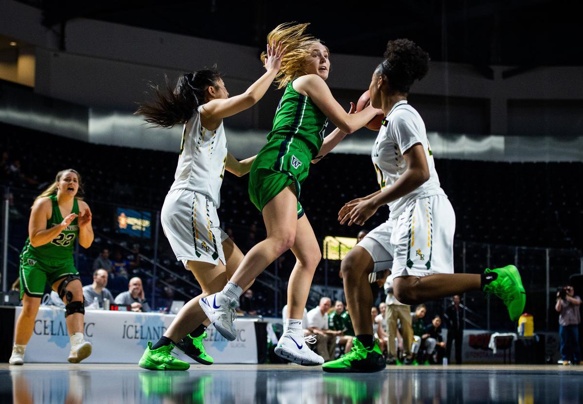 Woodinville’s Mia Hughes (24) spins and shoots in the third quarter. Kentridge played Woodinville in a basketball game at the Showare Center in Kent, Wash., on Monday, Jan. 21, 2019.