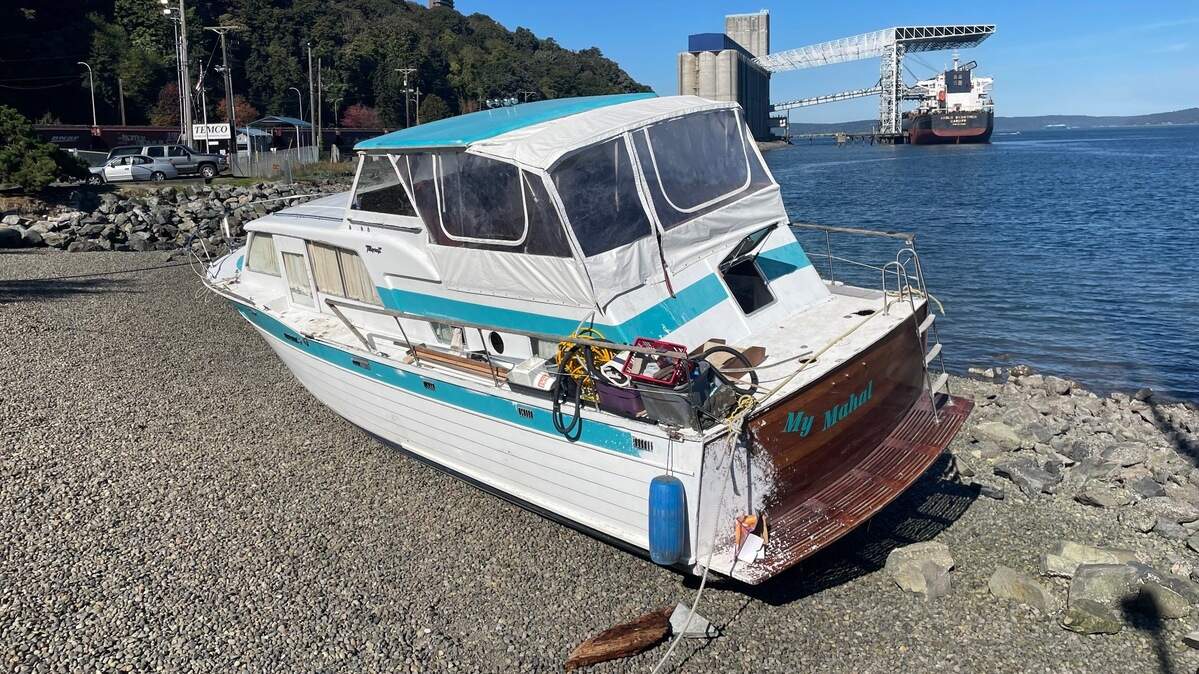 A live-aboard boat washed ashore at Thea’s Park in Tacoma last week and was removed by crane Monday, Sept. 30, 2024.