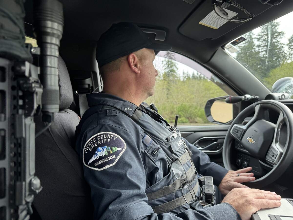 Pierce County Sheriff’s Office Deputy Nathan Betts drives his patrol vehicle through the Peninsula Detachment during a ride-along with a reporter Wednesday, April 9, 2025, in Key Peninsula, Wash.
