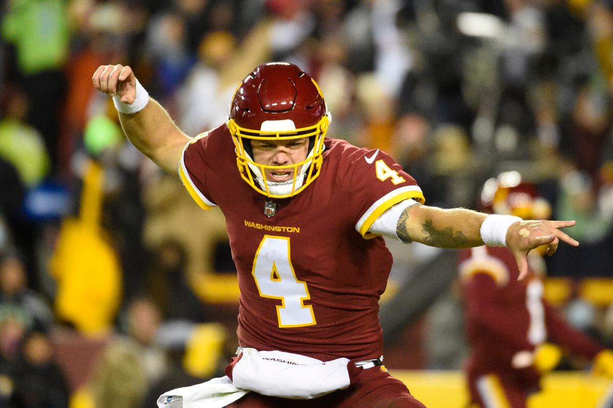 Washington Football Team quarterback Taylor Heinicke (4) celebrating a touchdown against the Seattle Seahawks during the second half of an NFL football game, Monday, Nov. 29, 2021, in Landover, Md. (AP Photo/Mark Tenally)