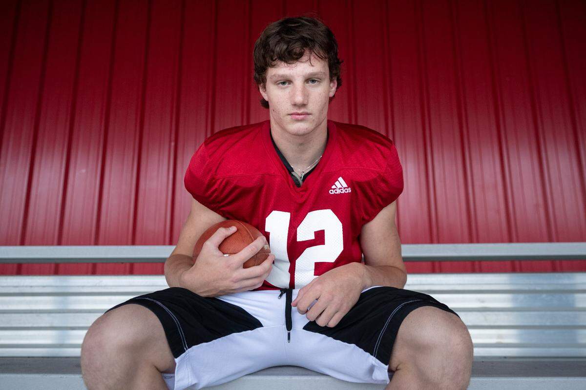 Mt. Si starting quarterback Clay Millen poses for a portrait after practice at Mt. Si High School, Seattle, on Sept. 23, 2019. Clay, a junior, comes from a family of quarterbacks. His older brother Cale, who used to be quarterback for the same high school, was picked up by University of Oregon. Both brothers are son of former NFL quarterback Hugh Millen, who played at University of Washington and for several NFL teams.