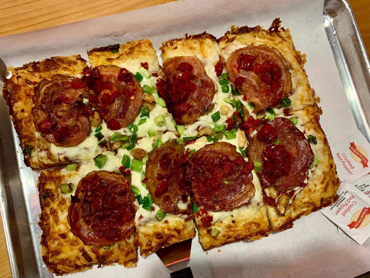 After serving from The Gourmet Niche, Tacoma Pie has opened its pizza restaurant at 4417 6th Ave. in Tacoma, Wash. The Vito features cherry peppers, roasted garlic, scallions and pancetta on a long-fermented crust with crispy frico on the outer edge.