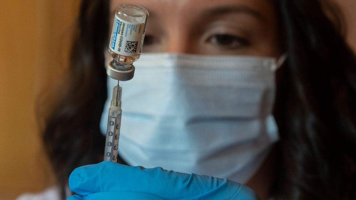 Alyssa Goff, a pharmacist at the Sumner Fred Meyer, fills a syringe with the one-shot Johnson & Johnson vaccine during a special clinic for local grocery and retail workers on Monday, April 12, 2021. The San Luis Obispo County Public Health Department will resume use of the Johnson & Johnson vaccine after pausing its use due to reports of blood clots among people who received the shots.