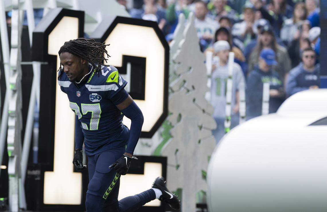 Seattle Seahawks cornerback Riq Woolen (27) runs out ahead of the game against the Arizona Cardinals at Lumen Field, on Sunday, Nov. 9, 2025, in Seattle.