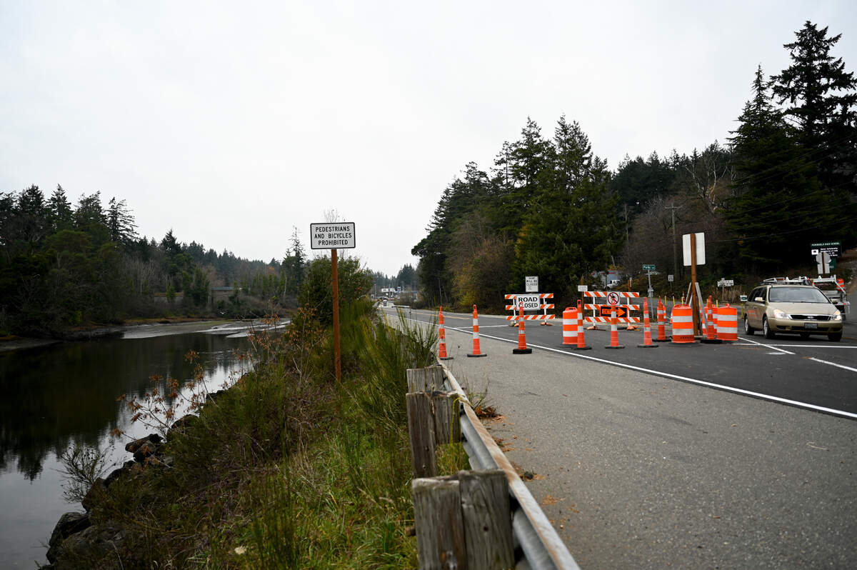Vehicles back up on Purdy Drive as Peninsula High School releases students Wednesday, Nov. 29, 2023, in Gig Harbor. For the last seven months, WSDOT has been doing construction to fix a culvert to allow for fish migration near the school.