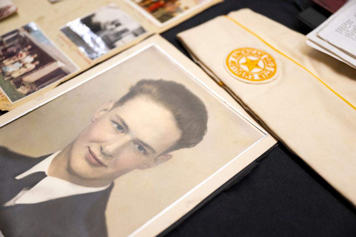 Photos and memorabilia of World War II soldier Lt. Victor Kandle is displayed in the halls during a dedication ceremony to rename the lobby in honor of him at Puyallup City Hall, on Tuesday, Nov. 12, 2024 in Puyallup.