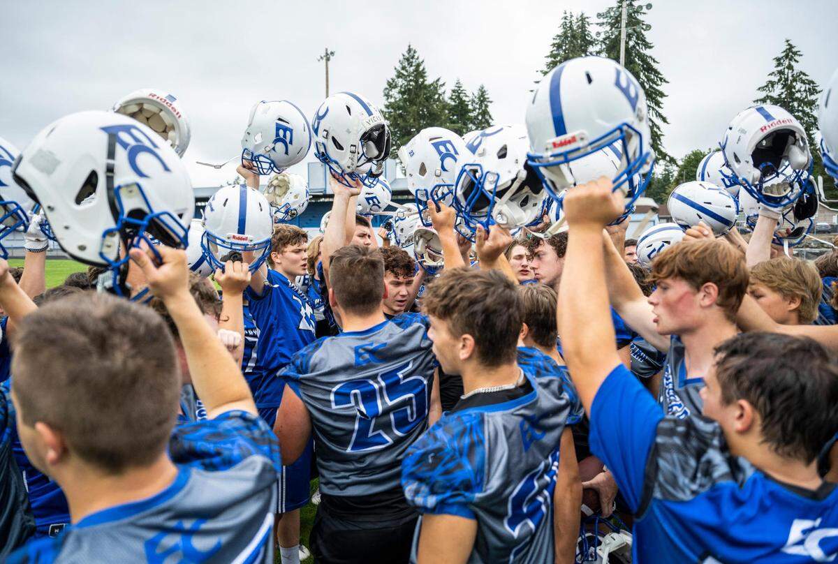The Eatonville Cruisers varsity football team huddles at the end of practice at Eatonville High School in Eatonville Wash. on August 20, 2022.