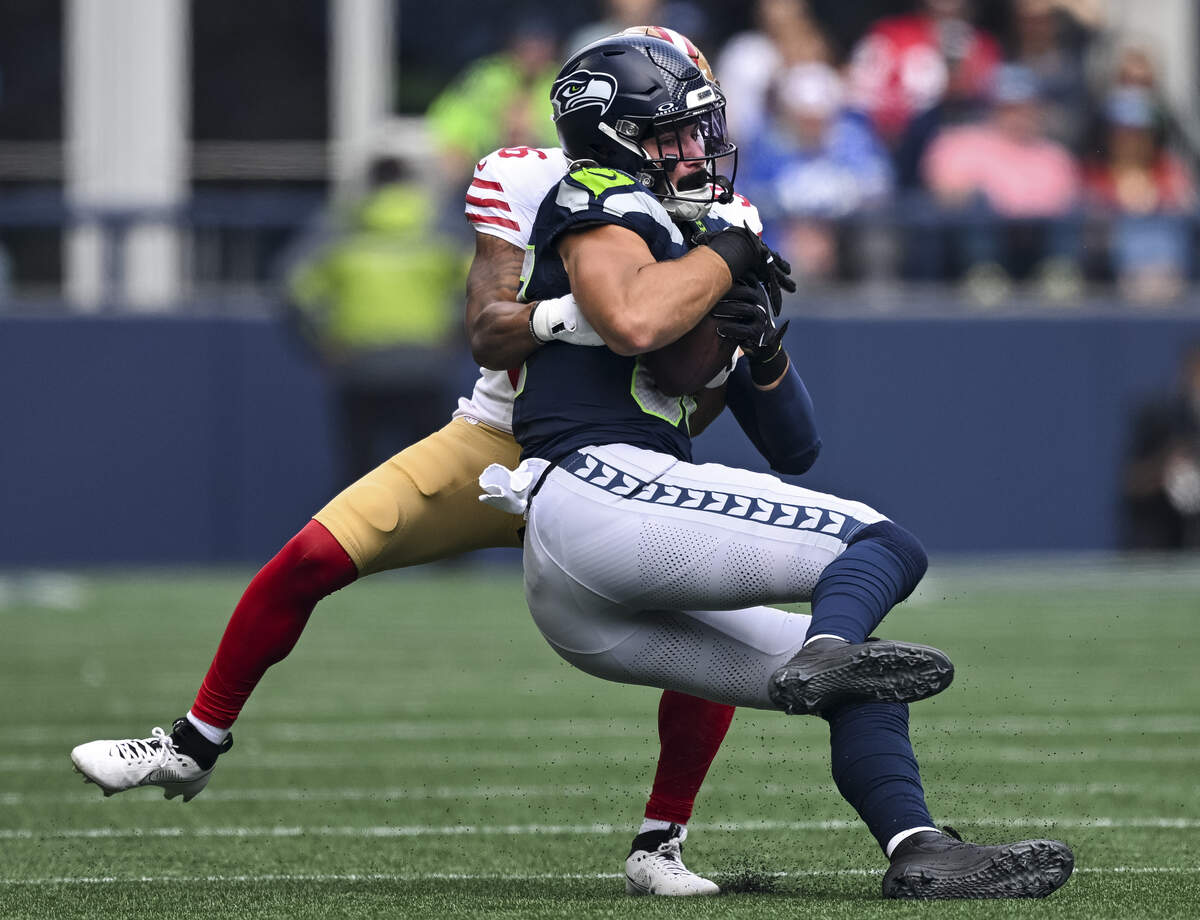 Seattle Seahawks tight end AJ Barner (88) is tackled after the catch against San Francisco 49ers safety Marques Sigle (36) during the first quarter of the game at Lumen Field, on Sunday, Sept. 7, 2025, in Seattle.
