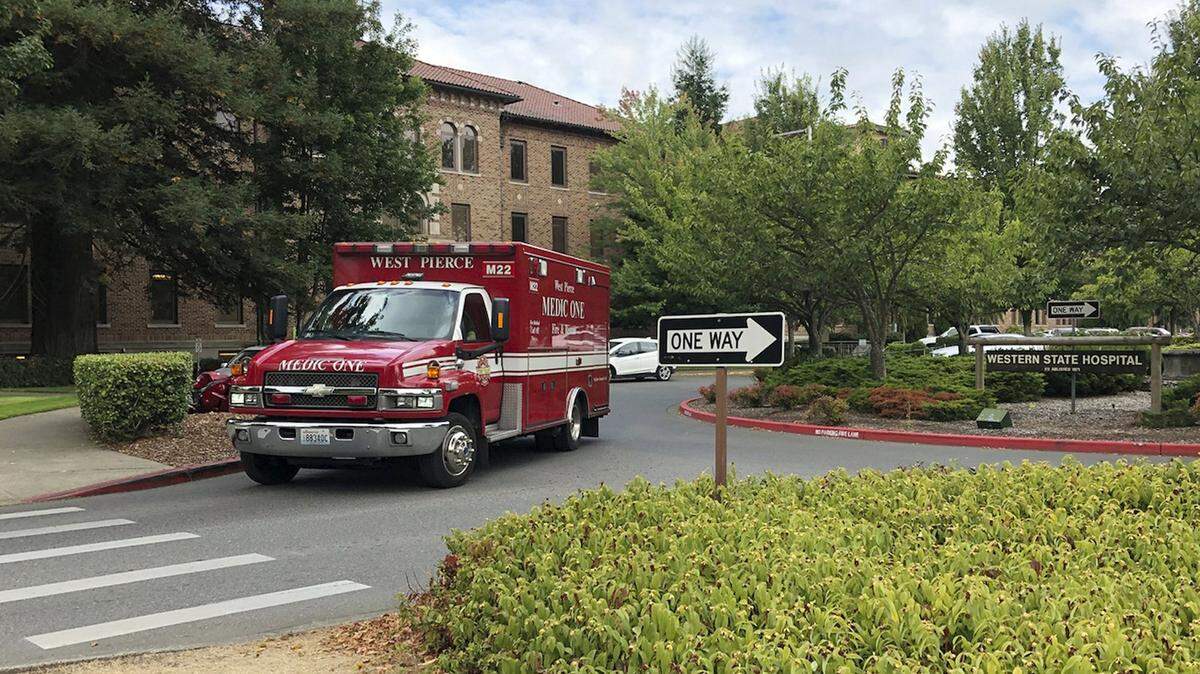 An ambulance leaves Western State Hospital in Lakewood. With around 850 beds, it is Washington’s largest psychiatric institution.