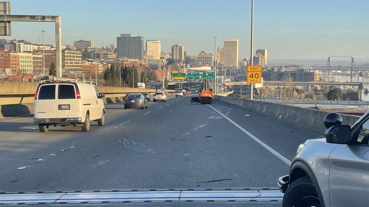 A vehicle has been flipped over on I-705 in Tacoma Monday morning following a hit and run crash.