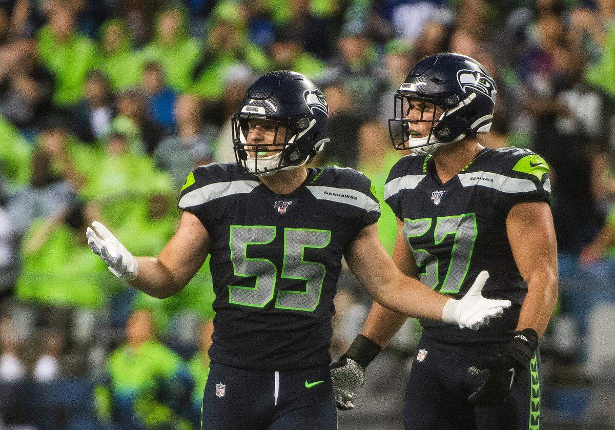 Seattle Seahawks linebacker Ben Burr-Kirven (55) and Seattle Seahawks linebacker Cody Barton (57) are confused by a penalty flag during the third quarter. The Seattle Seahawks played the Oakland Raiders in a National Football League game at CenturyLink Field in Seattle, Wash., on Thursday, Aug. 29, 2019.