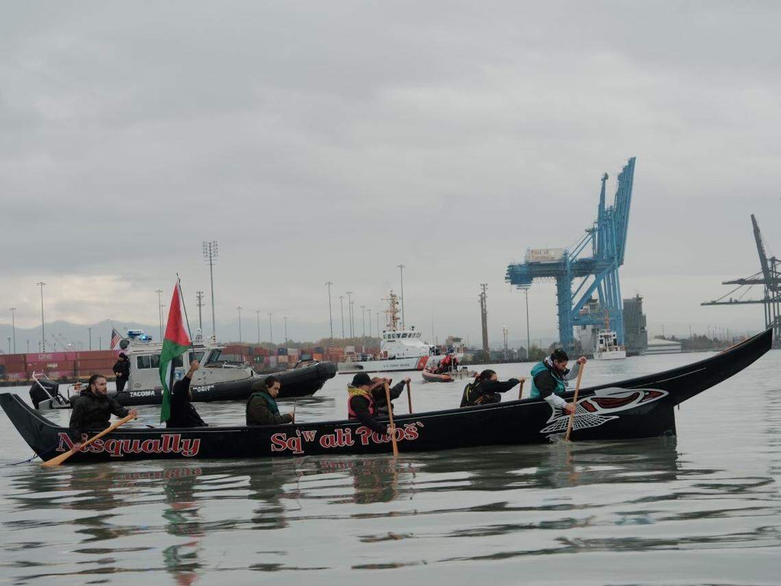 Coast Salish water warriors aboard a traditional Nisqually canoe paddle into the Port of Tacoma in an effort to block the MV Cape Orlando from leaving the port, on Monday, Nov. 6, 2023.