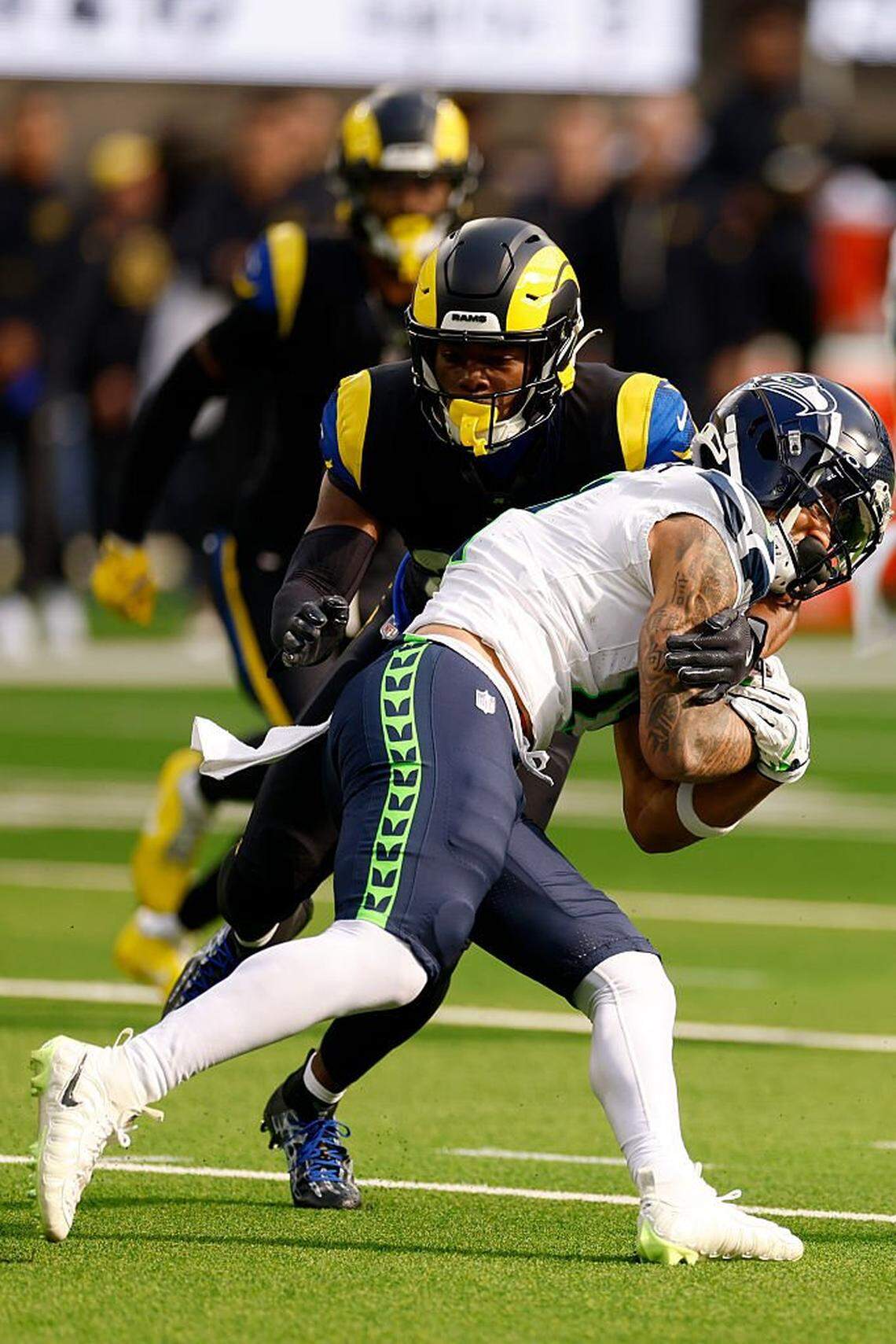 Los Angeles Rams safety Kamren Kinchens (26) tackles Seattle Seahawks Jaxon Smith-Njigba (11) during the first quarter at SoFi Stadium on November 16, 2025 in Inglewood, California. (Photo by Harry How/Getty Images)