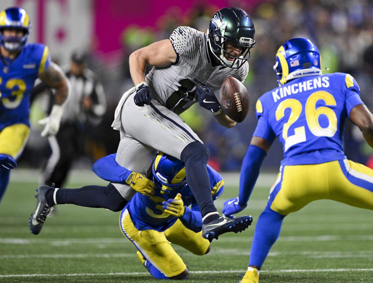 Seattle Seahawks wide receiver Cooper Kupp (10) fumbles the ball and it is recovered by Los Angeles Rams cornerback Cobie Durant (14) during the second quarter during the second quarter of the game at Lumen Field, on Thursday, Dec. 18, 2025, in Seattle.