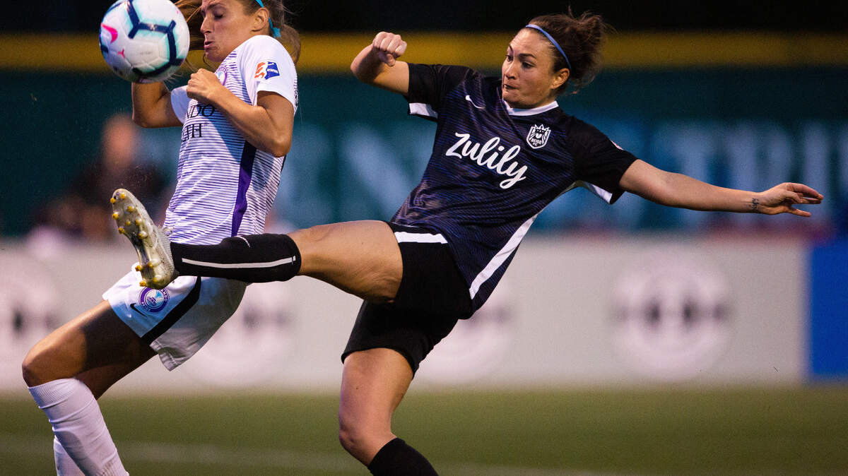 Reign FC’s Jodie Taylor fights for possession in the second half. The Reign FC played the Orlando Pride in a NWSL match at Cheney Stadium in Tacoma, Wash., on Sunday, April 21, 2019.