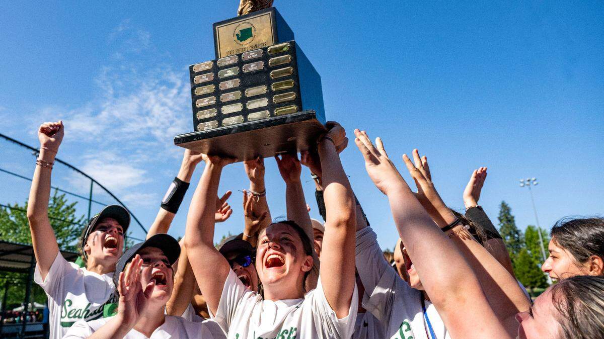 Peninsula players hoist the Class 3A championship trophy after beating Snohomish, 3-1, in the state championship game on Saturday, May 27, 2023, at Regional Athletic Complex in Lacey, Wash.