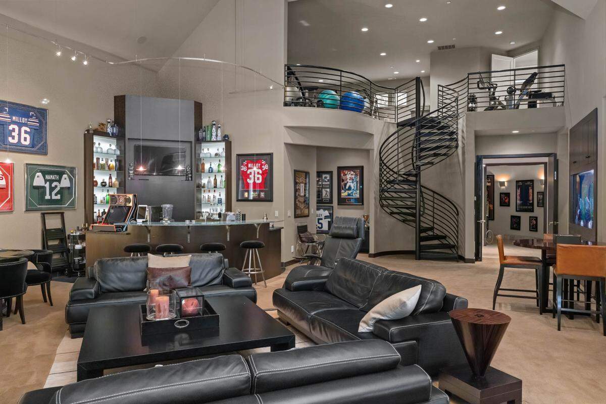 The home mixes the modern with the elegant. Some of the amenities are a full-court basketball court and a home movie theater.