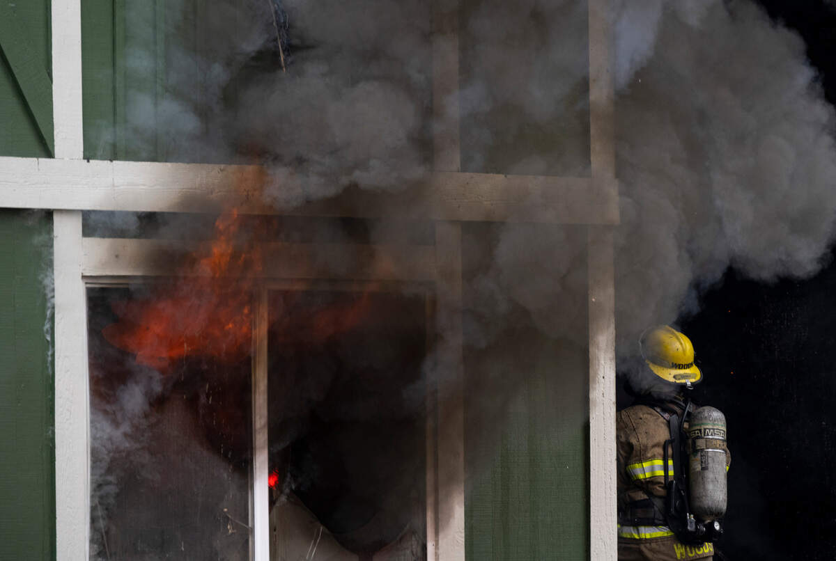 Firefighters from the Tacoma Fire Department battle flames at an apartment building on the 3300 block of E McKinley Avenue in Tacoma, Wash. on Monday, Feb. 21, 2022.