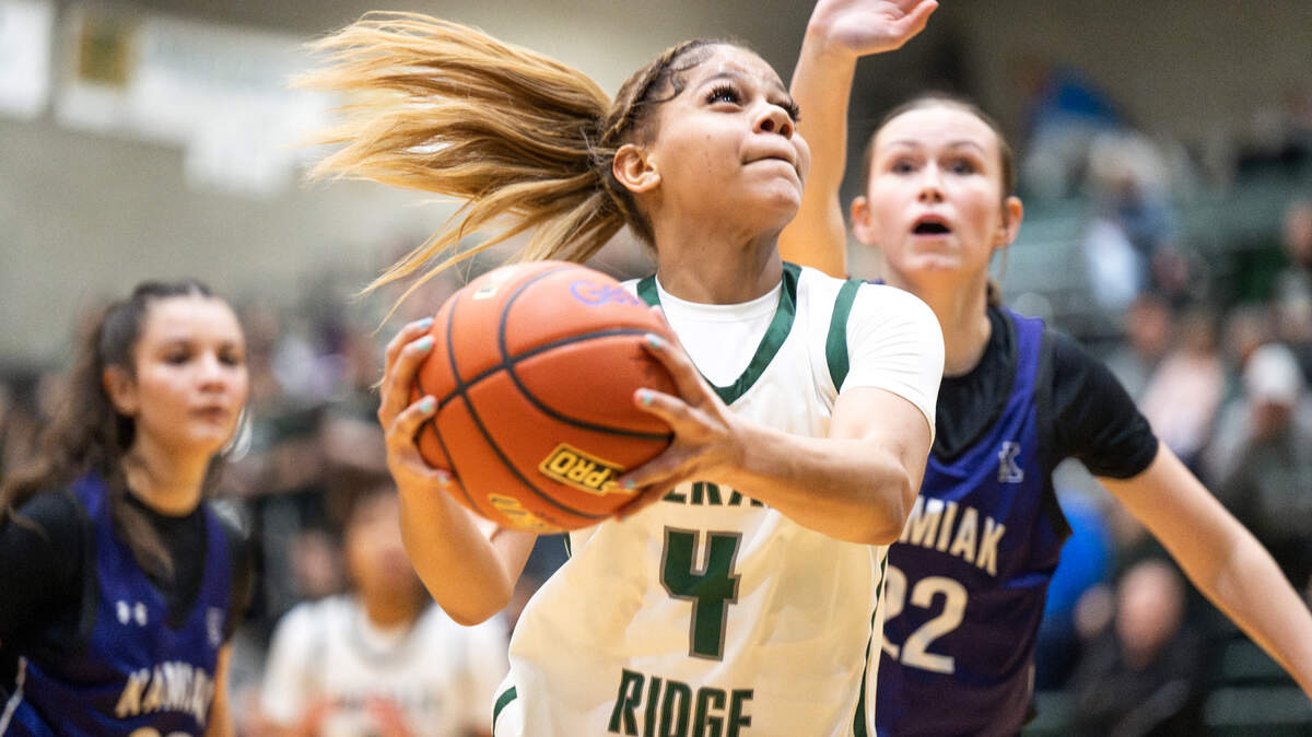 Emerald Ridge’s Naleila Cammack (4) goes to the basket against Kamiak players during the 4A state regional girls game at Auburn Senior High School, on Saturday, Feb. 24, 2024 in Auburn, Washington.