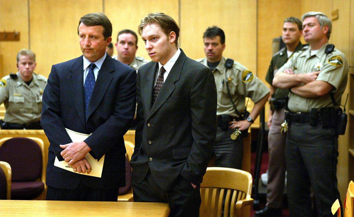 On June 1, 2004, Kurtis Monschke listens to the judge moments after being found guilty in the brutal beating death of Randall Townsend as defense attorney Erik Bauer, left, stands at his side in Pierce County Superior Court. Behind them are five of six Pierce County corrections officers assigned to escort Monschke in and out of the courtroom Tuesday.