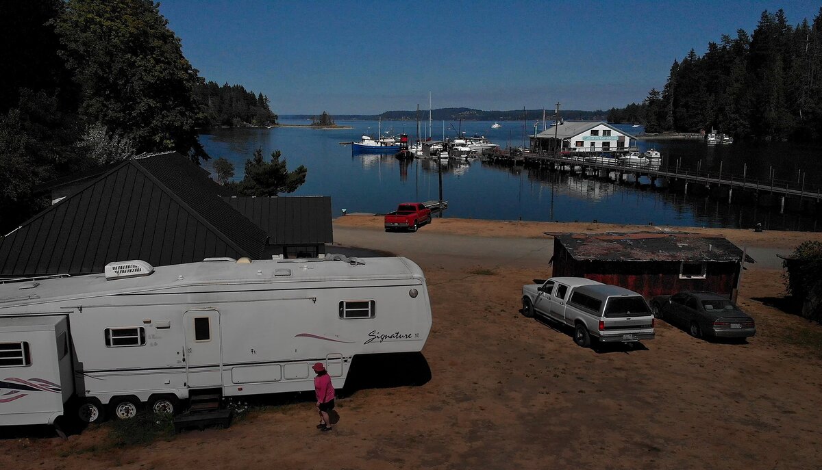 Cynthia Rose walks to her 36-foot trailer at the Lakebay Marina Tuesday, Aug. 7, 2018. Rose moved her trailer to the Key Peninsula after sleeping in her car for months. Now, her landlord Mark Scott, owner of Lakebay Marina, is trying to evict her.