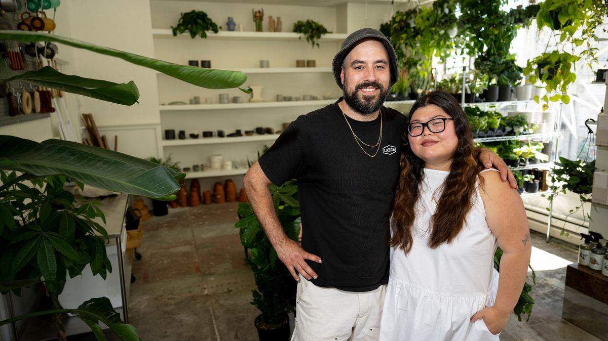 Co-owners Sarah Oh and Ryan McGowan pose for a portrait at Sunny’s on Aug. 3, 2023, in downtown Tacoma.