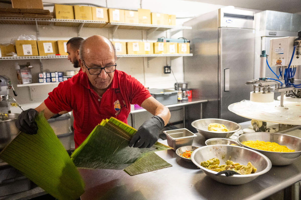At his restaurant in South Tacoma, Luis Betancourt makes tamales the way his Colombian mother taught him on Friday, Dec. 16, 2022. The recipe involves adding bacon fat to the masa and a special sauce before wrapping in banana leaves.