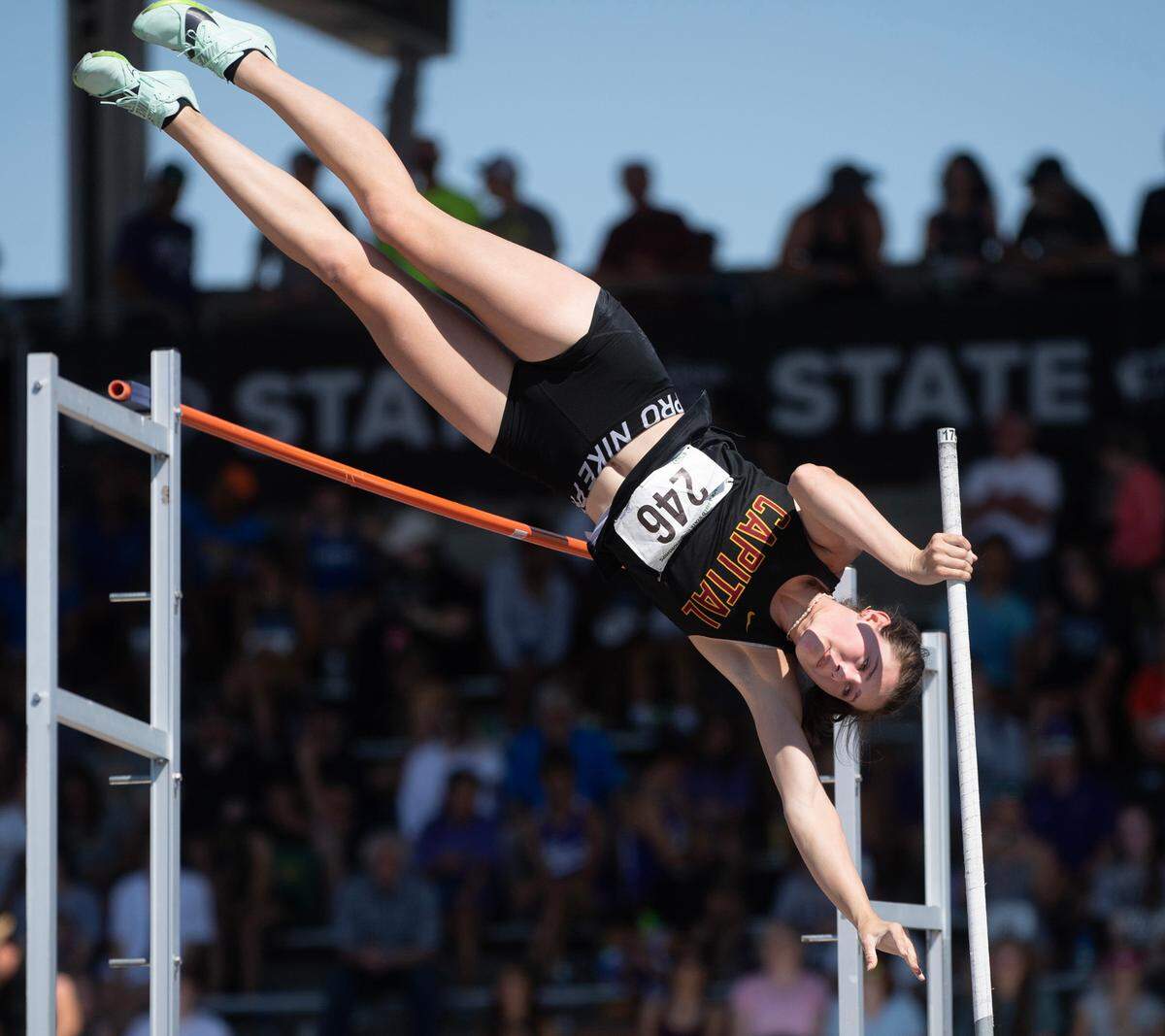 Capital’s Hana Moll goes up and over the bar en route to a a state title and new meet record of 14’ 7” during the second day of the WIAA state track and field championships at Mount Tahoma High School in Tacoma, Washington, on Friday, May 26, 2023.