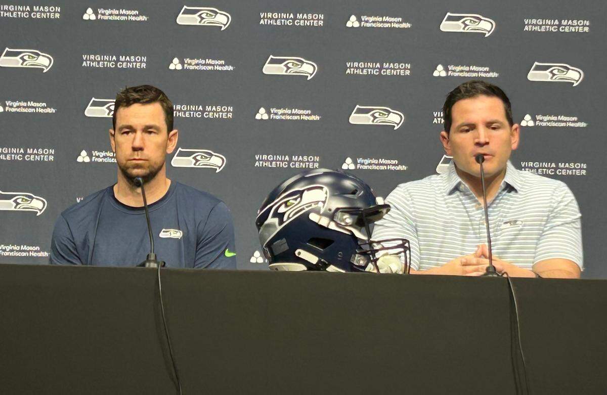 Klint Kubiak (left) as coach Mike Macdonald (right) introduces the 37-year-old former New Orleans Saints and Minnesota Vikings play caller as the Seahawks’ new offensive coordinator on Feb. 11, 2025, at the team’s Virginia Mason Athletic Center headquarters in Renton.