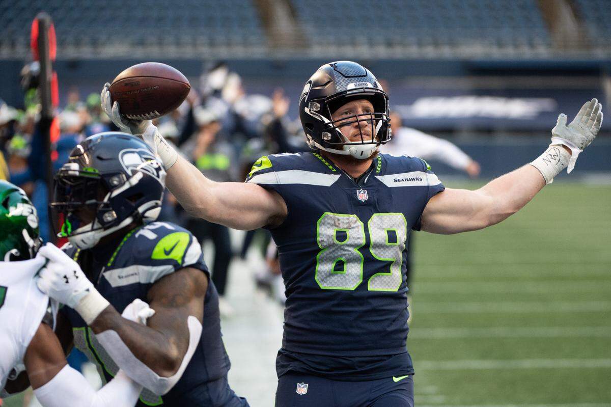 Seattle Seahawks tight end Will Dissly celebrates scoring a touchdown during the third quarter. The Seattle Seahawks played the New York Jets in a NFL football game at Lumen Field in Seattle, Wash., on Sunday, Dec. 13, 2020.
