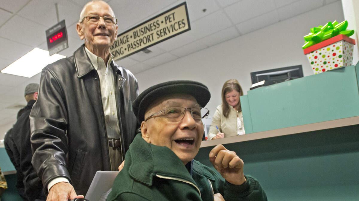 John McCluskey and Rudy Henry (seated) won a lottery to become the first same-sex couple issued a marriage license in Pierce County on Dec. 6, 2012, the first day that such marriages became legal in Washington state. The needs of older members of the local LGBTQ community are coming into clearer focus today.