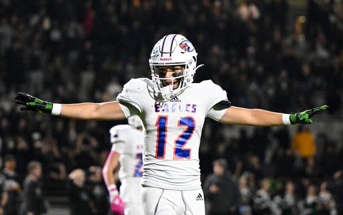 Graham-Kapowsin’s Cohen Miller (12) reacts to shutting down a pass intended for Emerald Ridge’s Tony Harste (5) during the second half of the game at Sparks Stadium, Saturday, Oct. 21, 2023, in Puyallup, Wash.