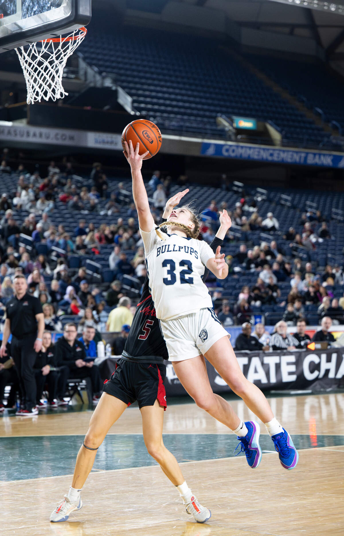 Gonzaga Prep’s Aylah Cornwall (32) goes for the layup and is fouled by Camas’ Parker Mairs (5) during the Class 4A state championship game at the Tacoma Dome, on Saturday, March 2, 2024, in Tacoma, Wash.