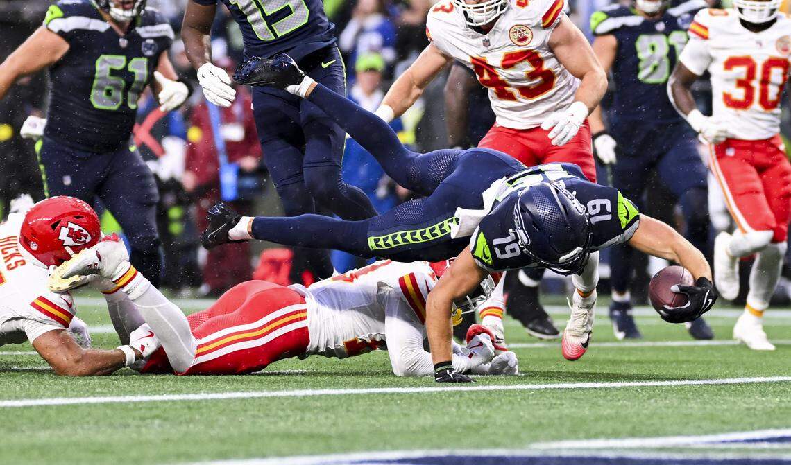 Seattle Seahawks wide receiver Jake Bobo (19) stretches in a touchdown during the second quarter of the preseason game against the Seattle Seahawks at Lumen Field, on Friday, Aug. 15, 2025, in Seattle.