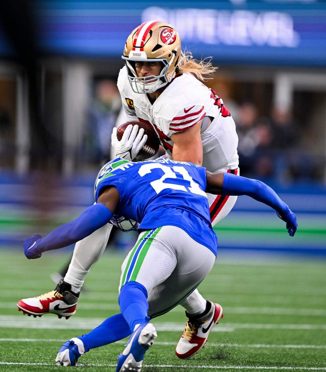 Seattle Seahawks cornerback Devon Witherspoon (21) closes in San Francisco 49ers tight end George Kittle (85) during the second quarter of the game at Lumen Field, on Thursday, Oct. 10, 2024, in Seattle, Wash.