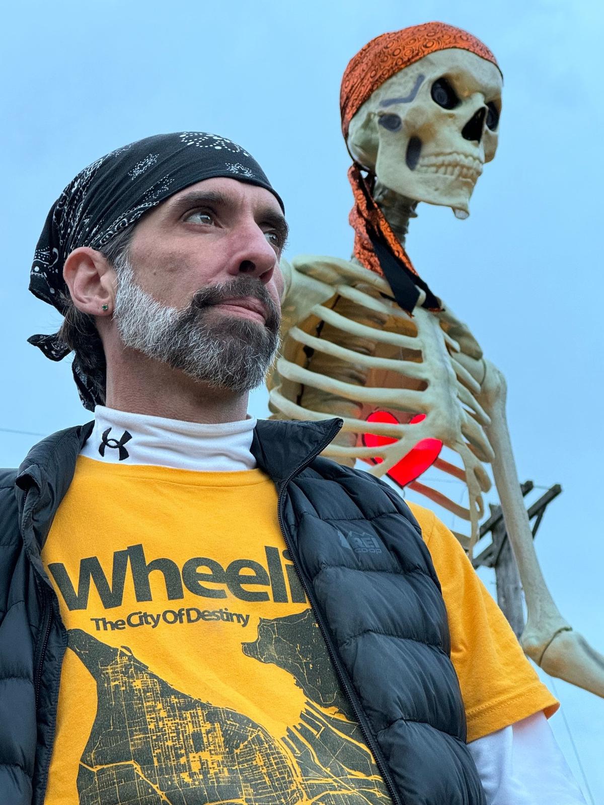 Artist John James Nelson and his giant skeleton at Titlow Beach have the same fashion sense.