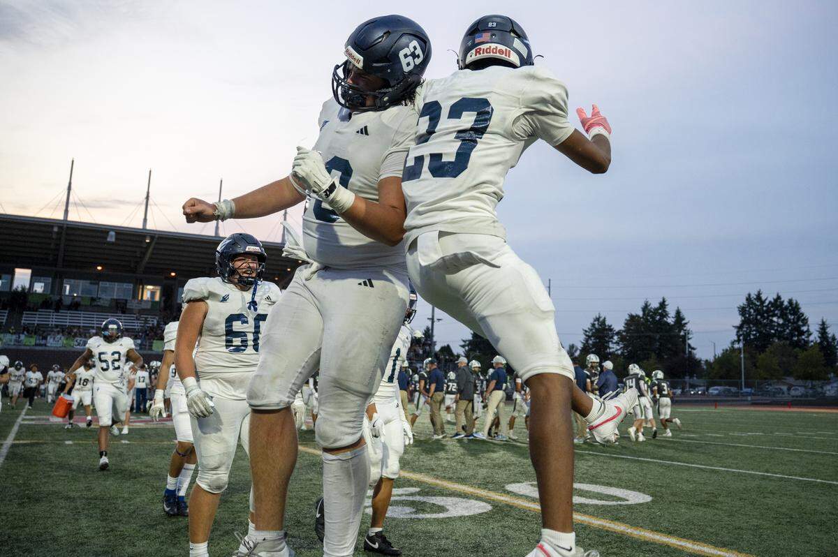Gig Harbor players celebrate their win over Peninsula on Saturday, Sept. 6, 2025, at Mount Tahoma Stadium in Tacoma, Wash.
