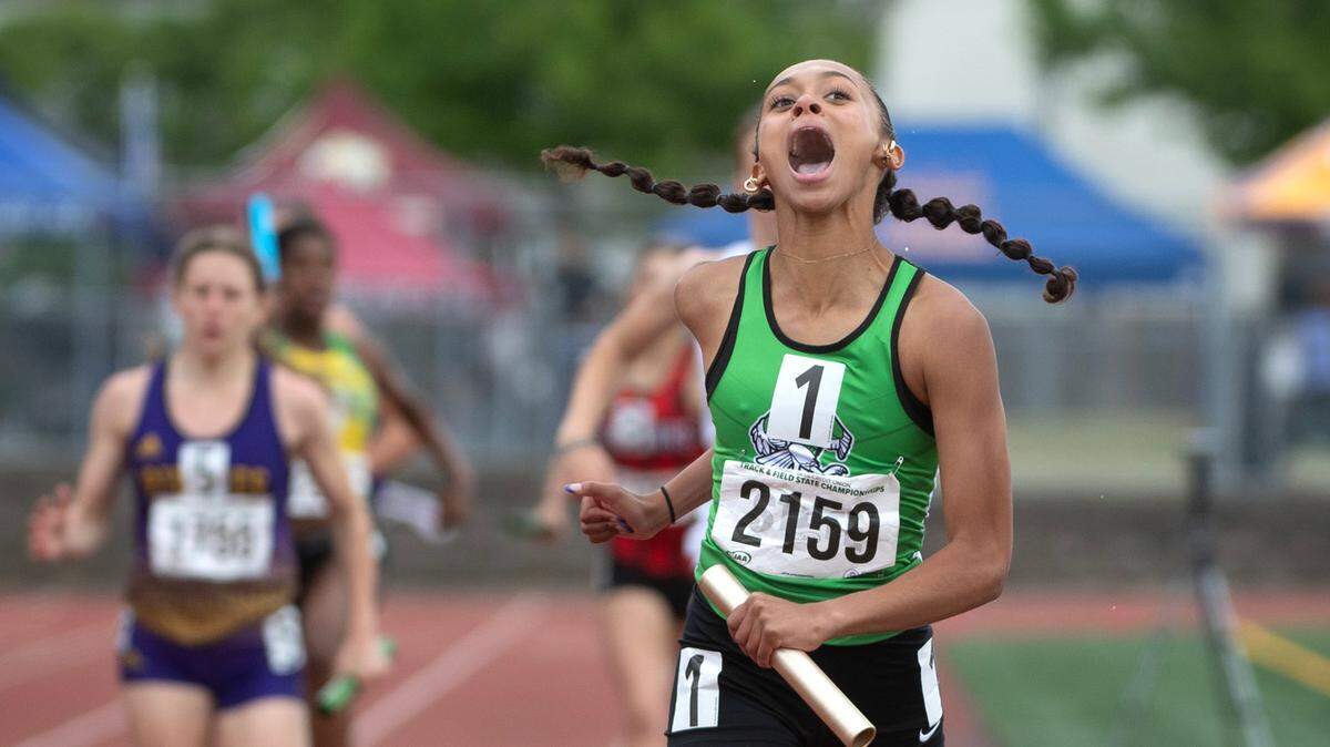 Tumwater’s Ava Jones erupts in joy as she crosses the finish line to give the T-Birds the state title in the 2A girls 4x200 relay during the final day of the WIAA state track and field championships at Mount Tahoma High School in Tacoma, Washington, on Friday, May 26, 2023.