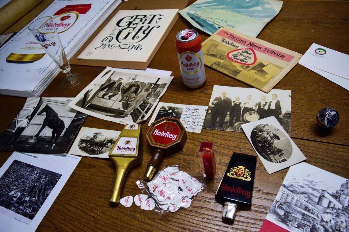 Heidelberg Beer artifacts from midcentury -- tap handles, photographs and a special section in The Tacoma News Tribune -- mingle with modern iterations, including a Beautiful Angles poster (upper left), guitar tabs and the 2021 edition can. 7 Seas Brewing resurrected the iconic Pacific Northwest lager in Oct. 2021.
