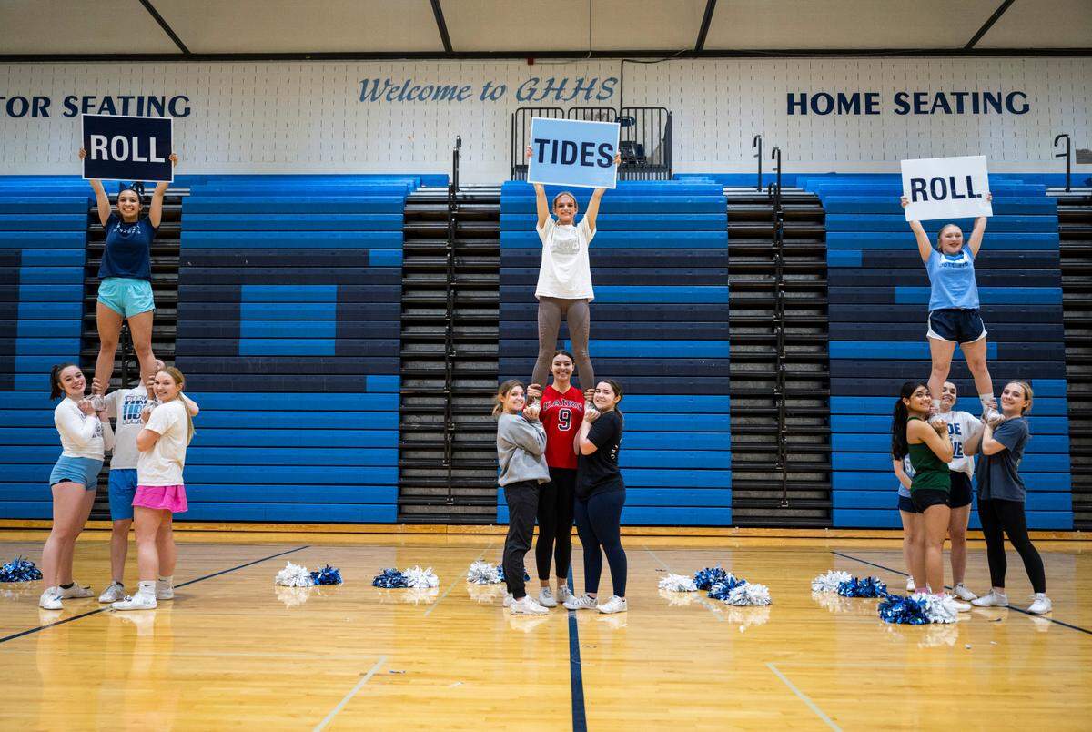 The Gig Harbor High School cheer team performs a stunt Feb. 28, 2023 in the school's gymnasium that was a part of their record-breaking routine. They competed in the 3A Game Day Small division competition at the Washington Interscholastic Activities Association (WIAA) Cheerleading Tournament Central Feb. 4, 2023.