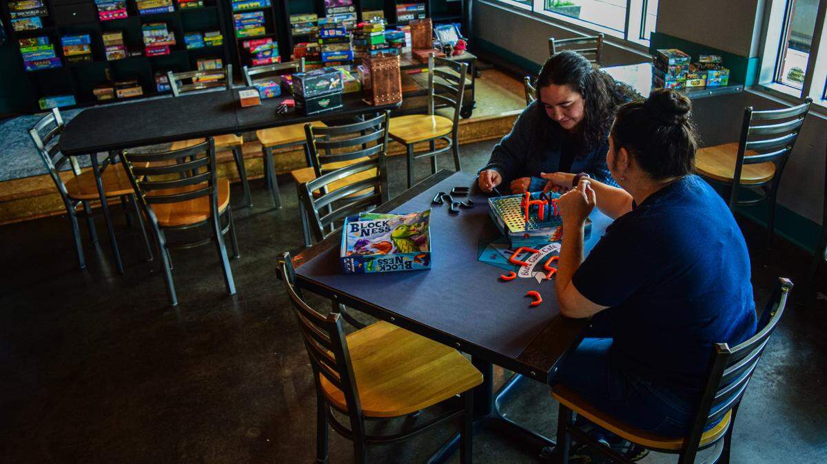 Sisters Rebekah (right) and Hannah Waltmann are opening The 15% Board Game Cafe, where they plan to offer more than 300 games for play as well as a cafe serving coffee, beer and wine.