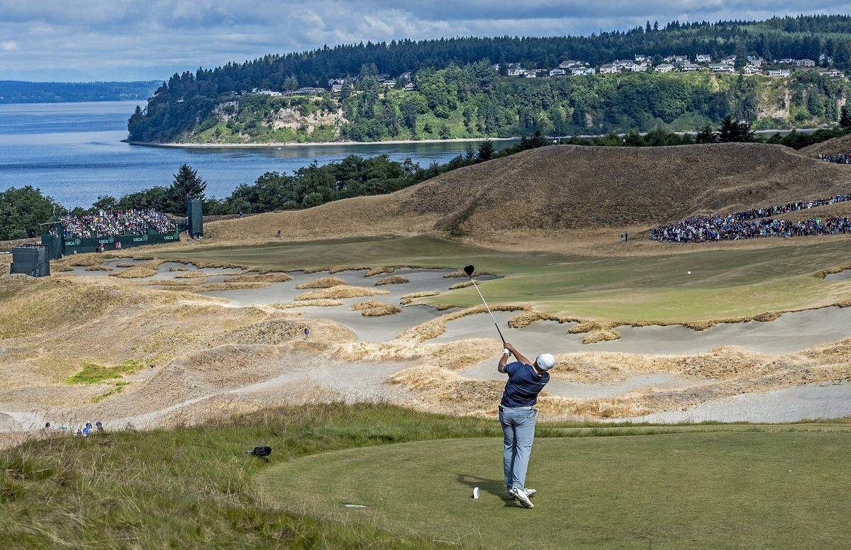 Jordan Spieth tees off with a sweeping view of Fox Island on the second day of the tournament at the 115th U.S. Open at Chambers Bay. Spieth went on to win the championship that weekend.