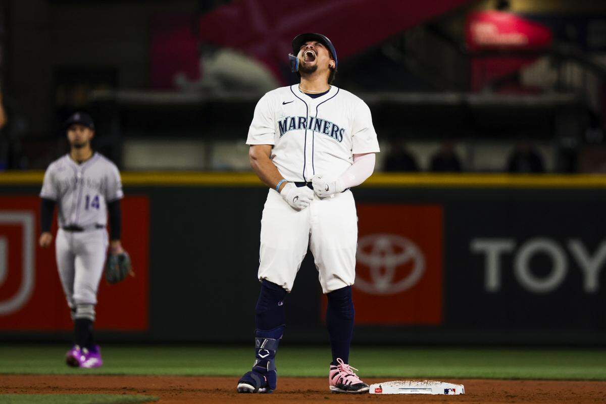 Sep 23, 2025; Seattle, Washington, USA; Seattle Mariners first baseman Josh Naylor (12) reacts after hitting a three-run double against the Colorado Rockies during the eighth inning at T-Mobile Park. Mandatory Credit: Joe Nicholson-Imagn Images