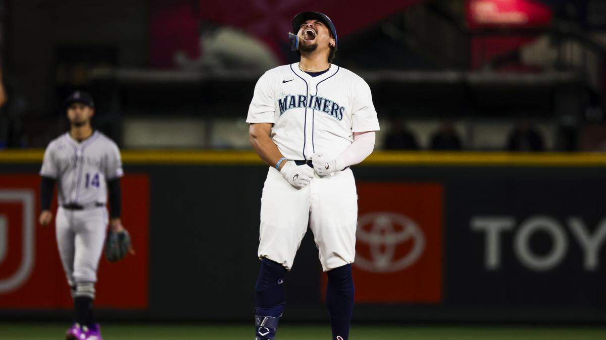 Sep 23, 2025; Seattle, Washington, USA; Seattle Mariners first baseman Josh Naylor (12) reacts after hitting a three-run double against the Colorado Rockies during the eighth inning at T-Mobile Park. Mandatory Credit: Joe Nicholson-Imagn Images